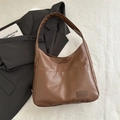 Minimalist caramel brown leather shoulder bag with vintage texture and front pocket - Brown