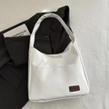 Minimalist white faux leather shoulder bag with vintage style and front pocket detail - White