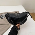 Minimalist black crescent shoulder bag with knotted strap detail in smooth PU leather - Black