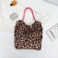 Chic plush leopard print tote bag with thick pink woven rope handles in a stylish layout - Pink