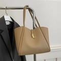 Chic khaki faux leather tote bag with gold geometric buckle on a hanger - Khaki