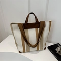 Vertical striped canvas tote bag with brown leather accents and wide shoulder strap - White