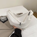 Modern white crescent crossbody bag with black zippers and adjustable wide strap - White