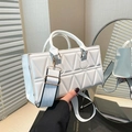White quilted crossbody bag with triangle pattern and stylish wide woven shoulder strap - White