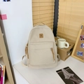 Sac à dos en toile crème avec détails en cuir marron et grande poche avant pour école - Kaki