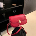 Vibrant red crossbody bag with golden hardware and adjustable leather strap - Red