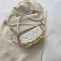 White quilted crossbody bag with gold chain strap and elegant rhombus texture design - White