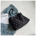 Minimalist black quilted tote bag with silver magnetic clasp and elegant chain straps - Black