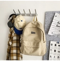 Minimalist beige campus backpack with large front pocket for students and daily travel - Off White