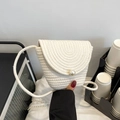 White woven crossbody bag with a large pearl accent and elegant layered flap design - Off White