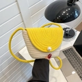 Handwoven crossbody bag in yellow and white straw with large pearl button detail - Yellow