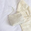 Minimalist white nylon handbag with embossed text on fine off-white fabric background - White