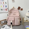 Pink multi-pocket school backpack with functional square flaps and stylish buckle details - Pink