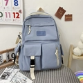 Detail of light blue student backpack with multiple pockets and durable buckles - Blue