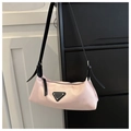 Pink nylon underarm bag with black leather strap and iconic triangle metal logo plaque - Pink