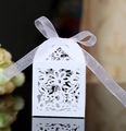 Elegant white laser-cut heart wedding favor box with a delicate white ribbon bow - White