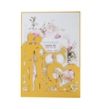 Detail of laser-cut gold pearlescent paper invitation with Mr & Mrs silhouette and rings - Gold