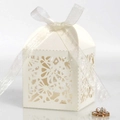 Elegant white laser-cut party favor box with butterfly ribbon and hollow floral patterns - Ivory