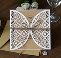 Close-up of laser cut hollow invitation cover with kraft paper insert and hemp rope bow - European Fine Hollow Style (HK-313)