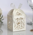 Ivory laser-cut candy box with floral patterns and a white ribbon bow for weddings - Ivory