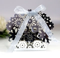 Laser-cut white wedding favor box with intricate floral hollow design and silver ribbon bow - Reflective Silver