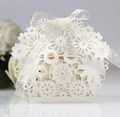 Elegant white laser-cut floral wedding favor box with a delicate organza ribbon bow - Starry White