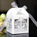 Elegant white laser-cut birdcage wedding favor box with a delicate white organza bow - White