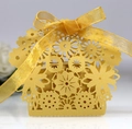 Exquisite gold laser-cut hollow flower candy box with matching ribbon and bow decoration - Gold