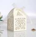 Elegant ivory laser-cut wedding favor box with floral patterns and a white silk ribbon - Ivory