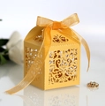 Golden laser-cut wedding candy box with elegant floral pattern and ribbon bow - Gold