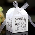 Elegant white laser-cut floral candy box with pearlescent finish and white ribbon bow - White