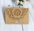 Laser-cut kraft paper wedding invitation with intricate lace edges and bird details - Beige Gold