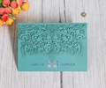 Detail of laser-cut floral pattern wedding invitation card with double happiness symbol - Teal Blue