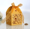 Elegant gold laser-cut floral wedding favor box with a matching organza ribbon bow - Gold