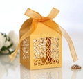 Elegant gold laser-cut favor box with intricate floral patterns and orange silk ribbon - Gold