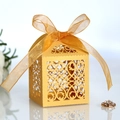 Golden laser-cut wedding favor box with intricate floral patterns and organza ribbon - Gold