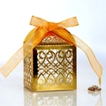 Shiny gold laser-cut wedding favor box with intricate patterns and orange silk ribbon - Reflective Gold