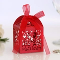 Elegant red laser-cut candy box with hollow lace pattern and matching red ribbon bow - Pearlescent Red
