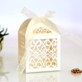 Elegant cream wedding candy box with laser-cut heart pattern and silk ribbon bow - Ivory