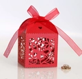 Detail view of laser-cut butterfly and floral patterns on a red wedding favor candy box - Pearlescent Red