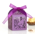 Detailed laser-cut purple pearl paper favor box featuring floral patterns and a silk ribbon - Deep purple
