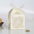 Elegant off-white laser cut wedding candy box with intricate floral pattern and ribbon bow - Ivory