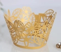 Golden laser-cut lace cupcake wrappers with elegant floral hollow-out pattern for parties - Gold