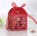 Elegant red laser-cut favor box with heart patterns and a matching silk ribbon bow - Pearlescent Red