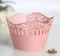Pink laser-cut cupcake wrappers with intricate lace pattern for wedding party decor - Pink
