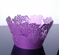Detail of laser-cut purple cupcake wrappers featuring intricate grape and vine patterns - Dark Purple