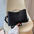 Modern black tote bag with geometric honeycomb texture and adjustable strap in focus - Solid Black