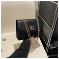 Elegant black shoulder bag with golden flower clasp and chain strap for women - Black
