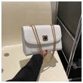 White leather shoulder bag with golden chain and black clover clasp detail - White