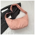 Detail of pink nylon hobo bag showing puffy texture and wide shoulder strap for casual wear - Pink